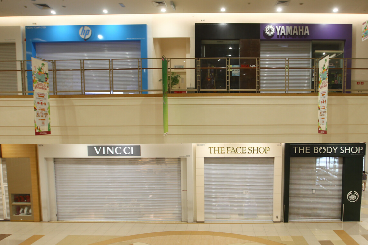 Shops closed in a mall during the Movement Control Order. (Photo by Patrick Goh/The Edge)